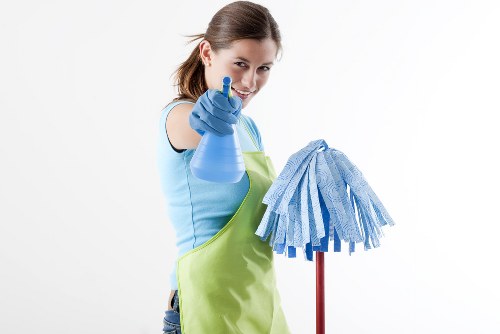 Cleaner preparing carpet cleaning equipment for a booked service