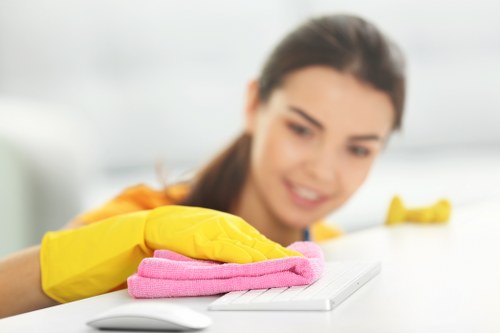 Warning signs and safe cleaning setup on a carpeted floor